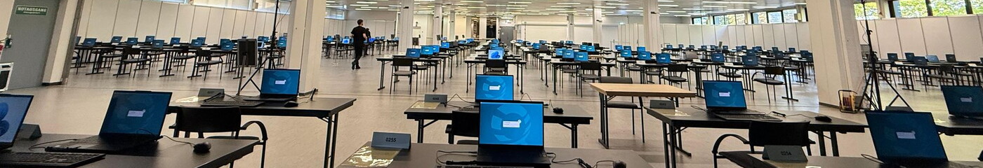 Exam hall with rows of prepared laptops for the electronic tax advisor exam 2026